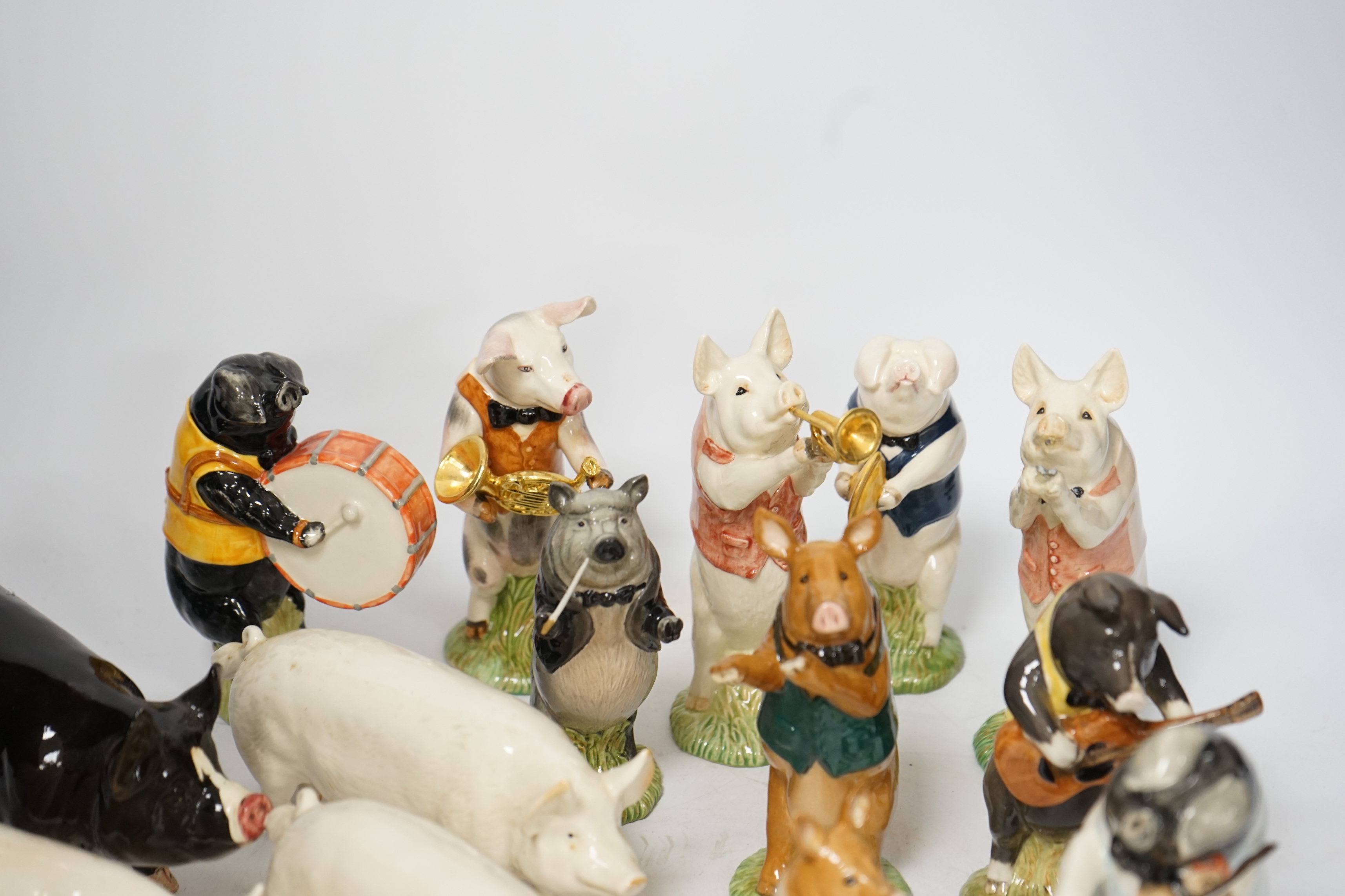 Five Beswick pigs and ten Beswick pig musician band figures